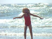 Summer playing in the waves